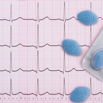 A graphic of a heart rhythm background with an overlay of blue pills.
