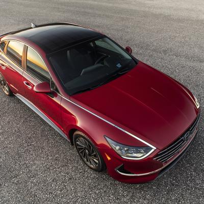 A view from the top of a red Hyundai 2022 Sonata Hybrid, showcasing its solar power roof.