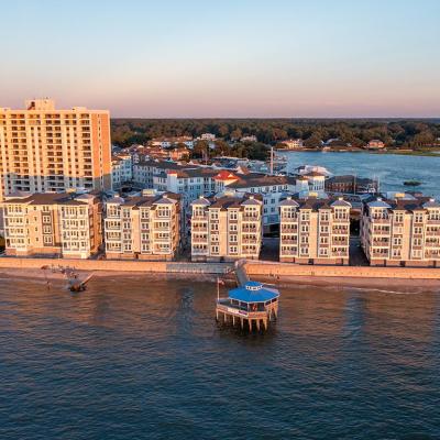 Aerial view of condos and a pier in Virginia Beach, Virginia at sunset.