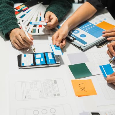 A creative team collaborating on UX product development.