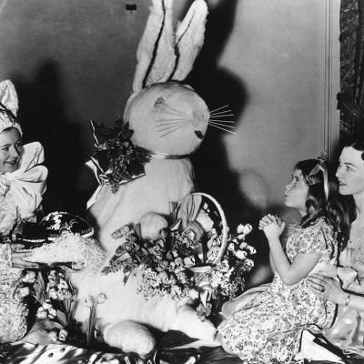 Historical photo of young girl praying to Easter Bunny in New York in 1936.