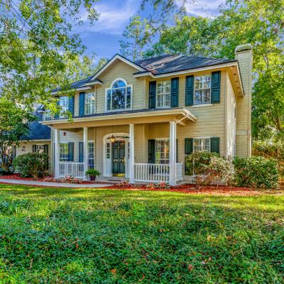 Two story home surrounded by trees in Fleming Island, Florida.