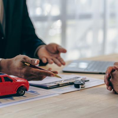 A car insurance transaction between a salesman and customer.