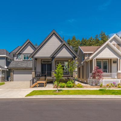 A row of contemporary modern three-bedroom homes.