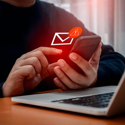 Person receiving a fraudulent text message.