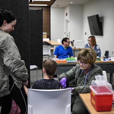 A medical staff member administers a dose of the measles vaccine to a child at a health center in Lubbock, Texas.