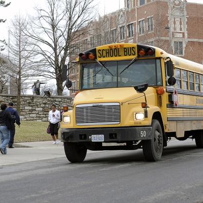 Students around a school bus in Kansas City, Missouri.