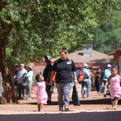 Winona Hastings and her daughters walk through the village of Supai on their way to the Havasupai Head Start and Early Start Program. 