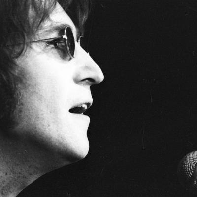 Musician John Lennon formerly of "The Beatles" performs onstage at the Chrysler Arena on Dec. 10, 1971 in Ann Arbor, Michigan.