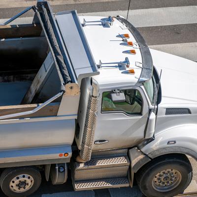 A large semi truck crossing a pedestrian lane.