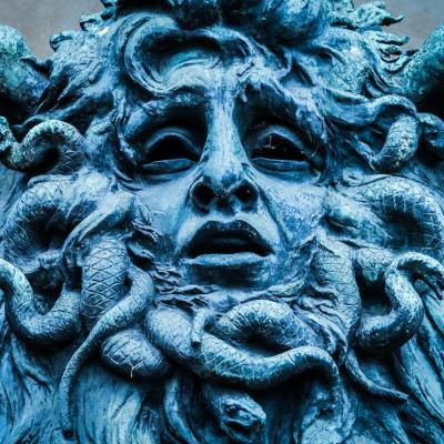 Medusa's head made of bronze close to the historical garden of Valentino in Turin.