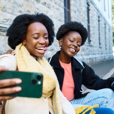 Two friends taking a selfie.