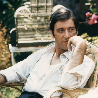 Al Pacino seated in garden as Michael Corleone from the 1972 movie 'The Godfather'