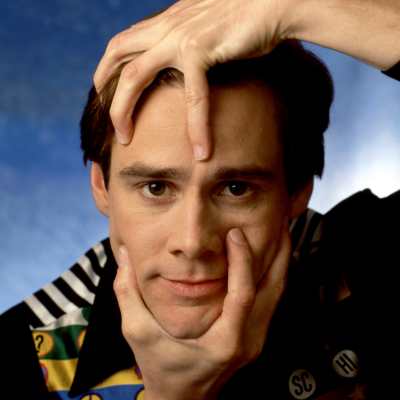 Actor and comedian Jim Carrey poses for a portrait grabbing his head and chin in Los Angeles, California, October 24, 1994. 