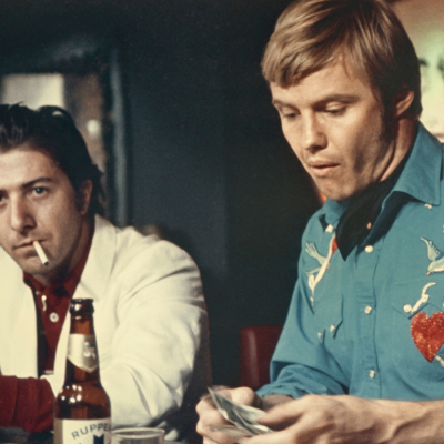 Jon Voight and Dustin Hoffman bat bar in scene from the 1969 film 'Midnight Cowboy'.