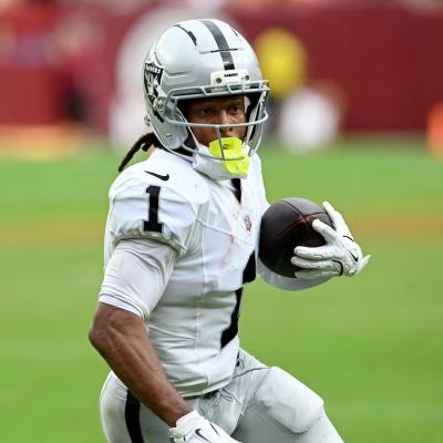 Tre Tucker of the Las Vegas Raiders scores a fourth-quarter touchdown against the Washington Commanders at Northwest Stadium in Landover, Maryland, on September 21, 2025.