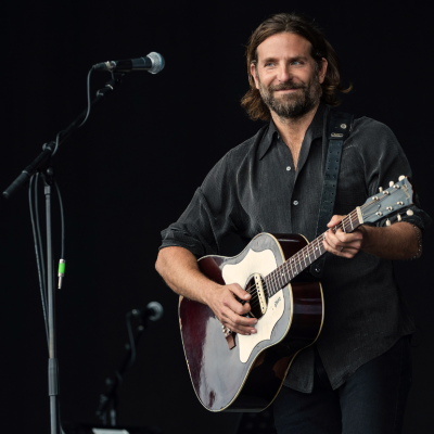 Bradley Cooper performs on the Pyramid stage to shoot footage for "A Star Is Born" at the 2017 the Glastonbury Festival.