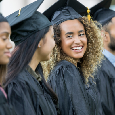 Female college graduates in line to receive their diplomas