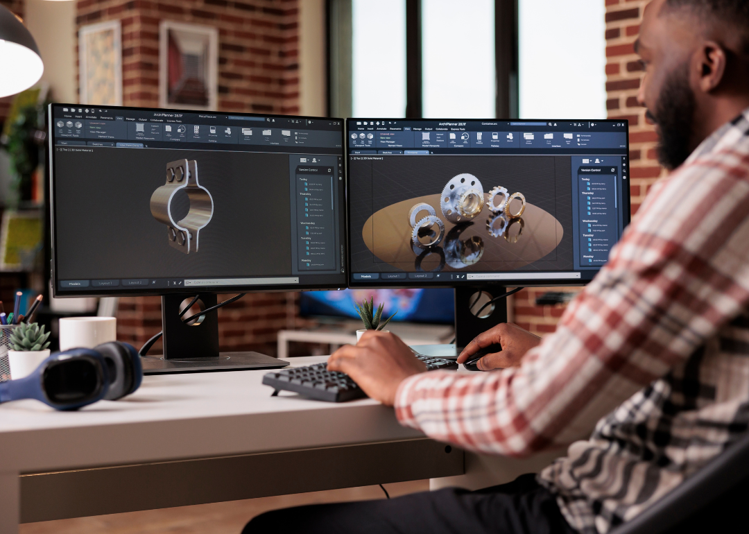 An engineer using CAD software to model a new invention.