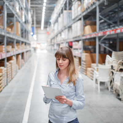 A woman working in a furniture warehouse.