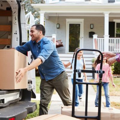 Family unloading a moving truck.