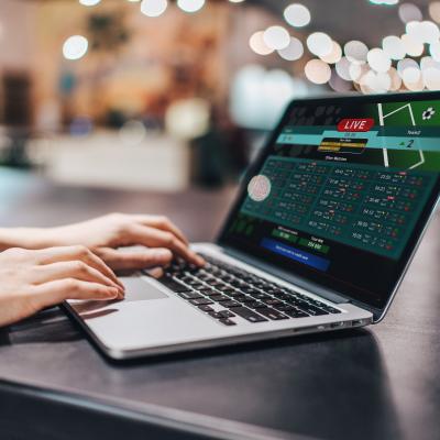 Girl making bets online on sport bookmaker's website.