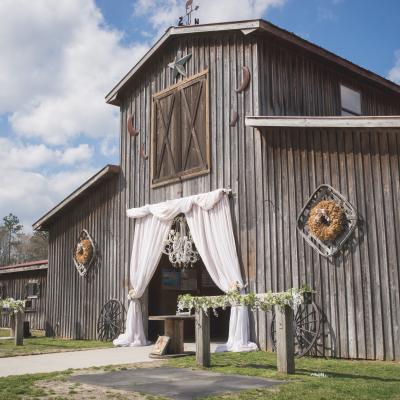 Old wooden barn decorated for wedding ceremony.