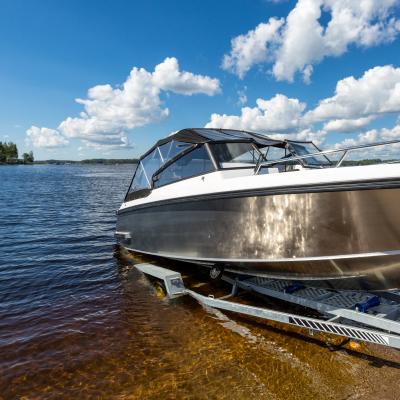 Boat launch on lake water from trailer.
