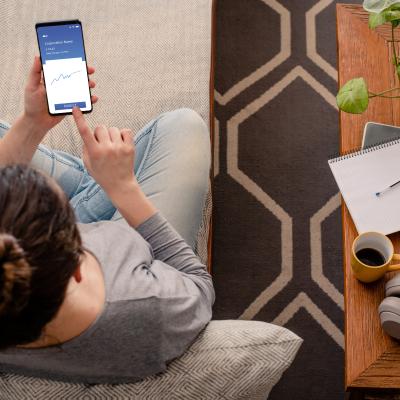 Woman using investment mobile app.