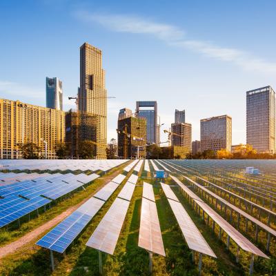 Solar power plant with skyline in background