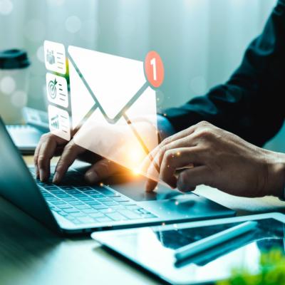 A man checking email on a laptop.