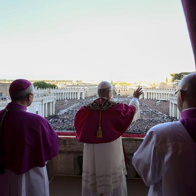 Newly elected Pope Leo XIV, Robert Prevost, waving at the crowd on the main central loggia balcony overlooking St. Peter's Square on May 08, 2025 in Vatican City, Vatican. 
