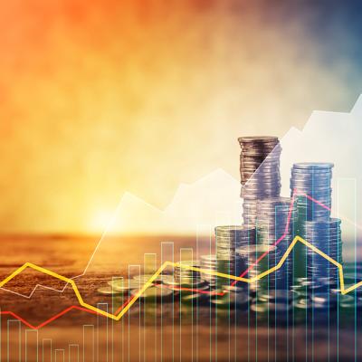 Stacks of coins with an overlay of steady stock trendline graphics.