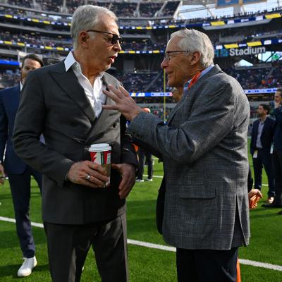 Stan Kroenke, owner of the Los Angeles Rams, talks with Rob Walton, owner of the Denver Broncos before a game at SoFi Stadium in Inglewood, California.