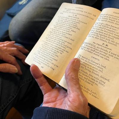 'Amazing Grace' as it appears in Ginny Hawker's family heirloom songbook, Lloyd’s Primitive Baptist Hymns. You can see stains in the margins, left by the tobacco-covered hands of her aunt Annie Maud Puckett. 