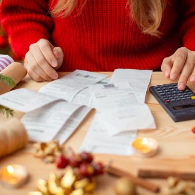 Person calculating expenses for the holidays.