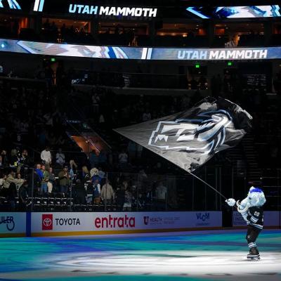 Tusky, the mascot for Utah Mammoth, waves a flag at center ice after the game against the San Jose Sharks at Delta Center in Salt Lake City on Friday, Oct. 17, 2025.
