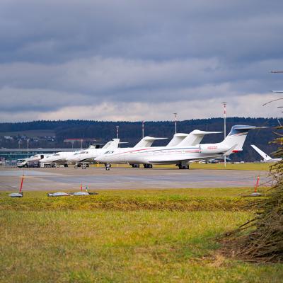 Private jets parked at a Swiss airport.