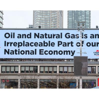 Advertisement sign by Action Canada about the Oil and Natural Gas Industry.