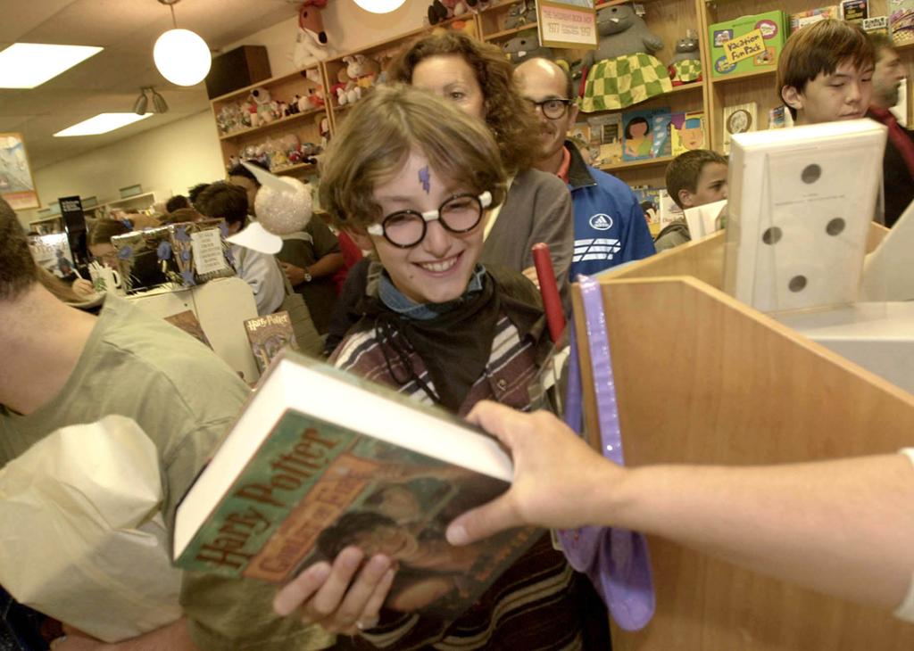 A young fan gets his Harry Potter and the Goblet of Fire book during its release on July 8, 2000.