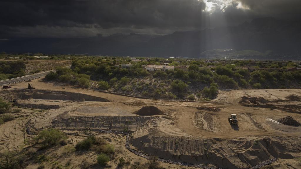 Heavy equipment kicks up dust at a construction site near Tucson, Arizona. 
