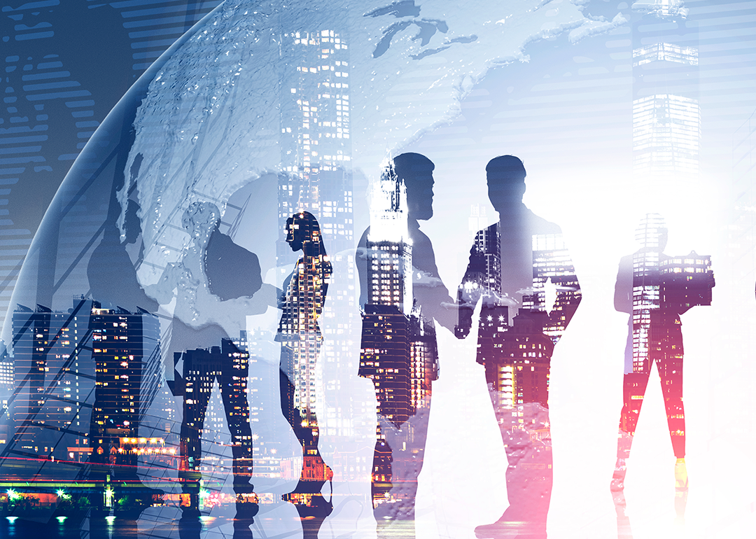 Business team members standing over night city background with double exposure of planet.