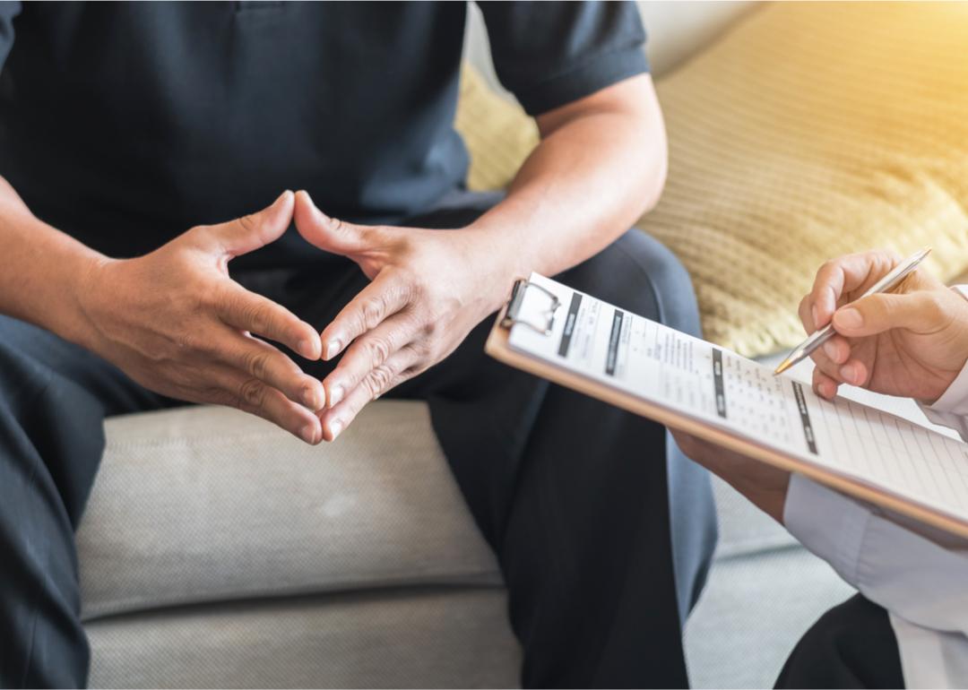 Male patient consulting with doctor