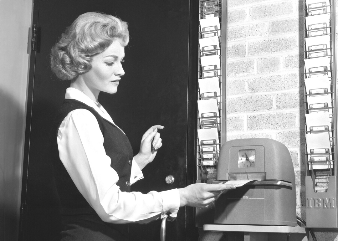 Woman punching time clock