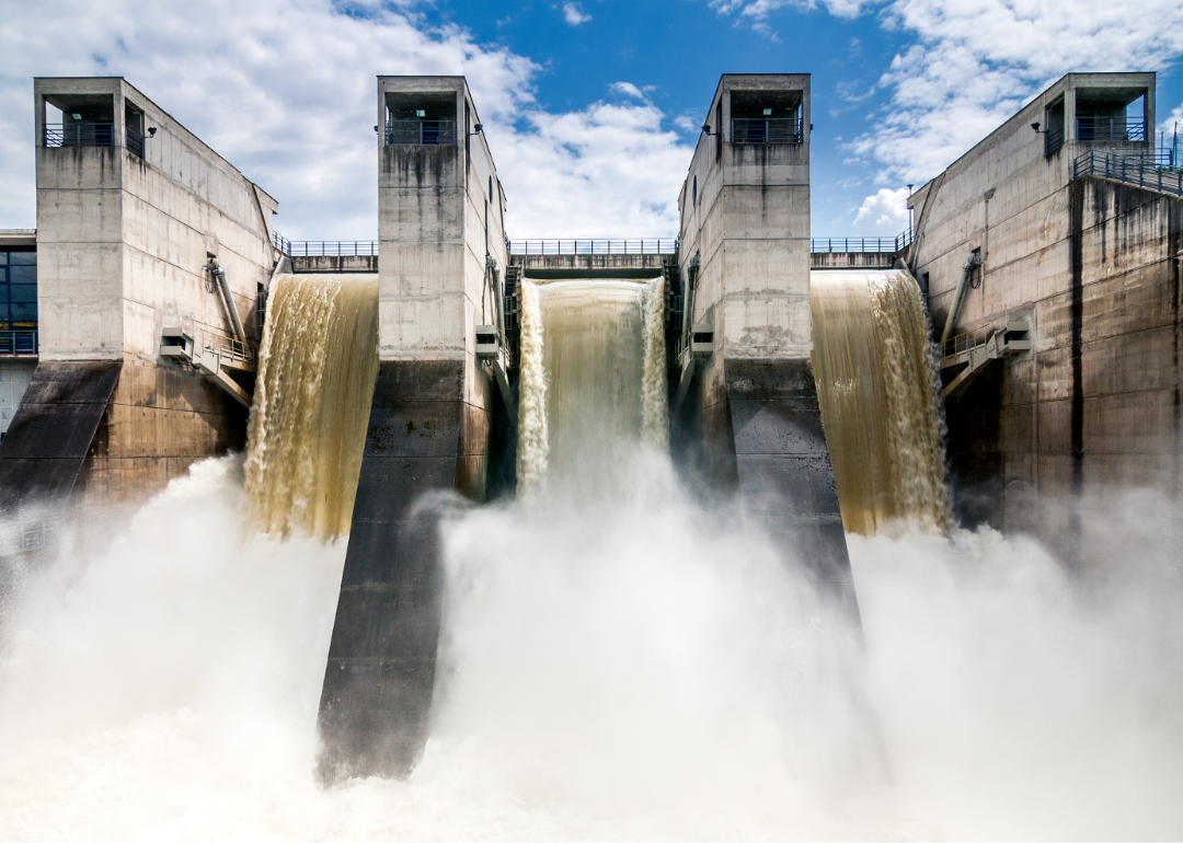 Powerful falls in a concrete hydroelectric dam.