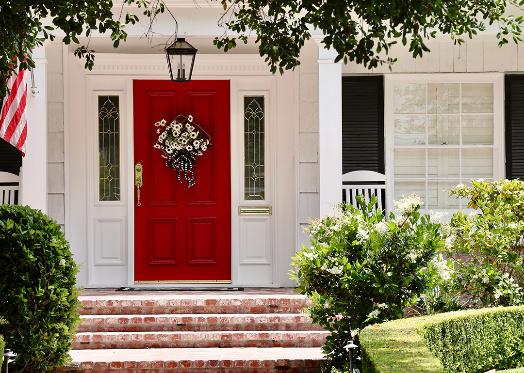 House with red door and American flag.