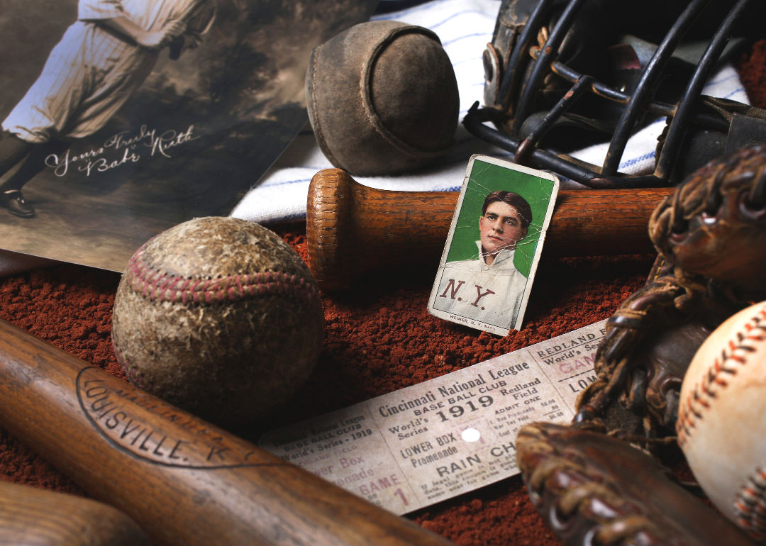 A collection of vintage baseball memorabilia including a baseball card of Babe Ruth
