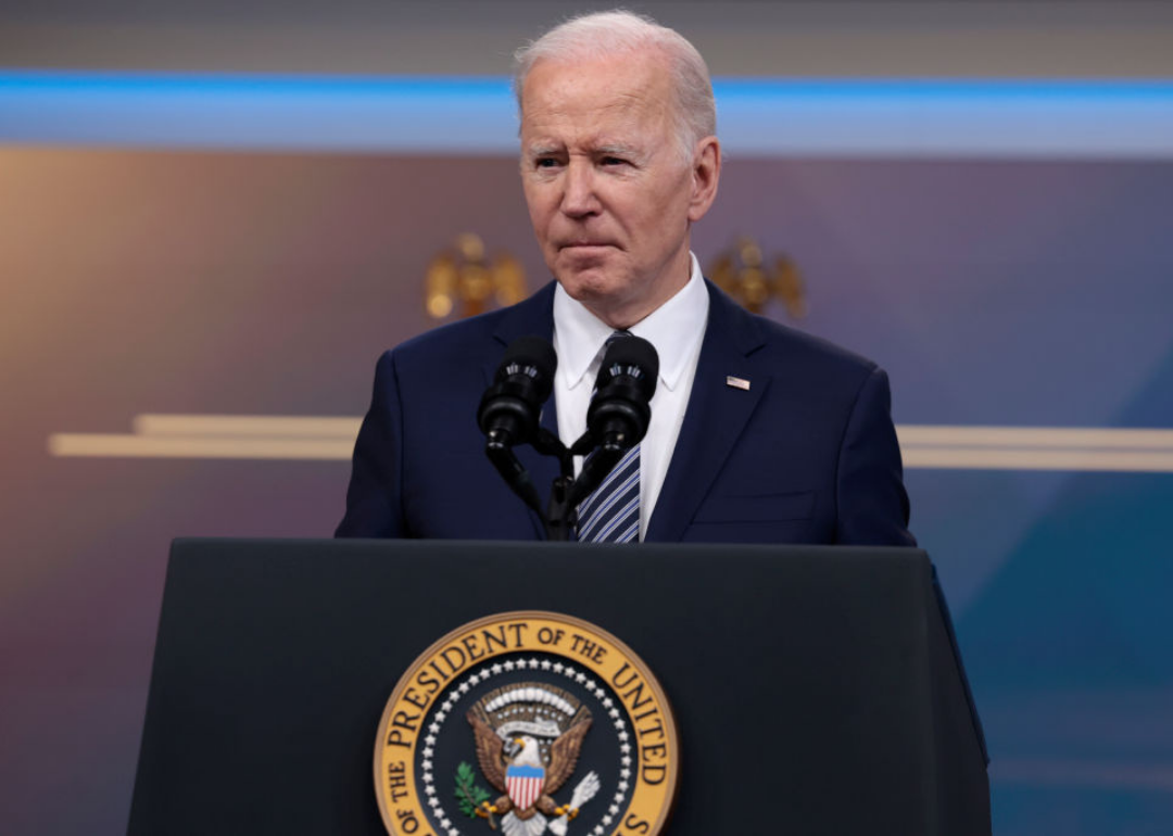 President Biden stands at a podium while discuss the release of oil from Strategic Petroleum Reserve