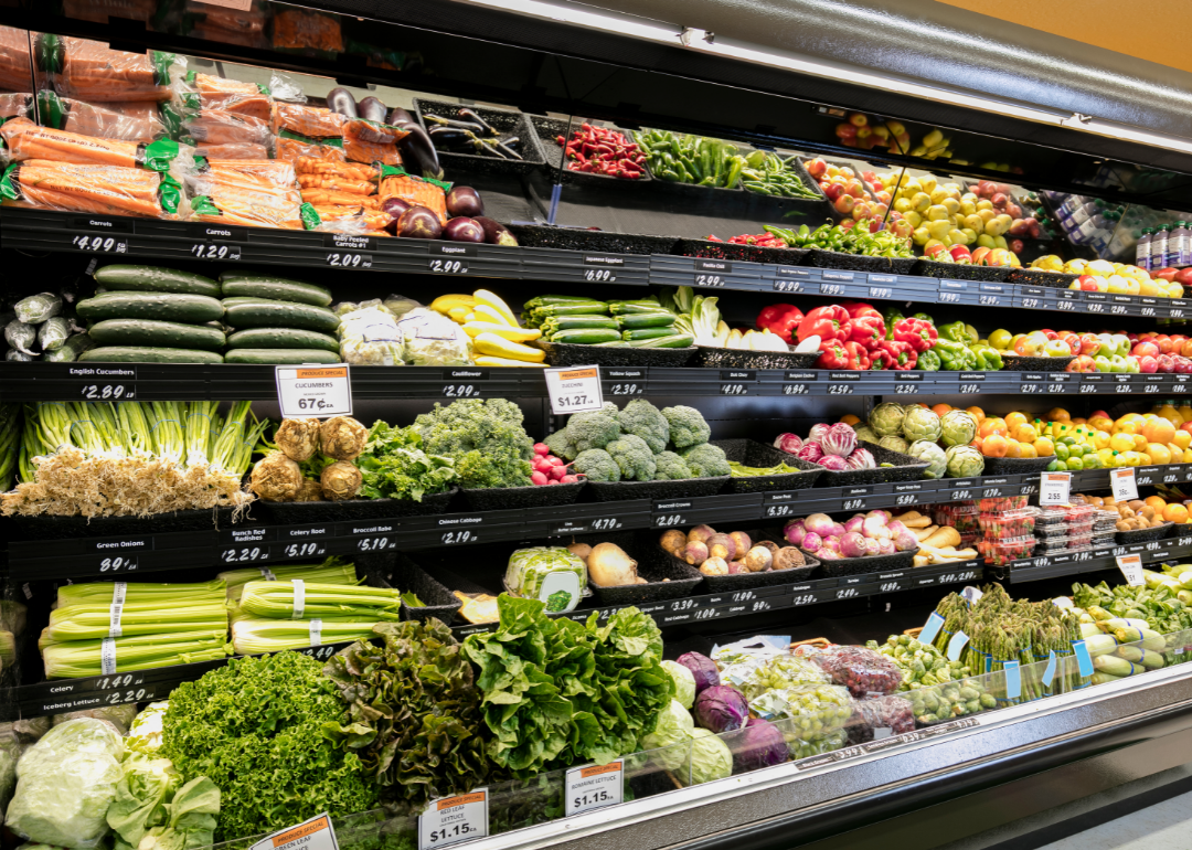 Grocery store shelves filled with produce.