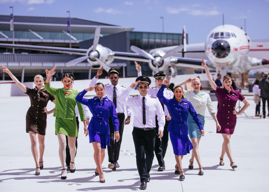 Models pose in front of the TWA theme hotel